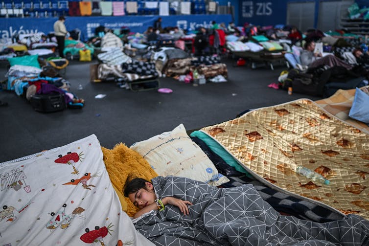 a gym converted into a refugee shelter