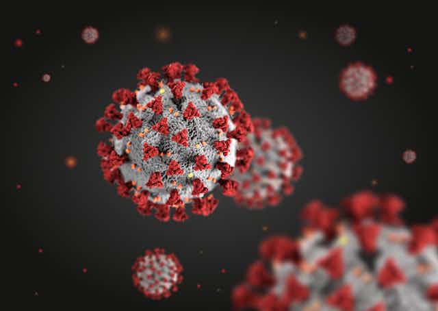 Three-dimensional illustration of coronavirus particles floating in a liquid environment.