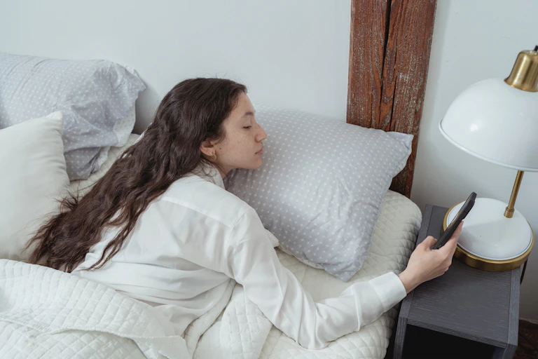 Girl on bed wakes up from sleep