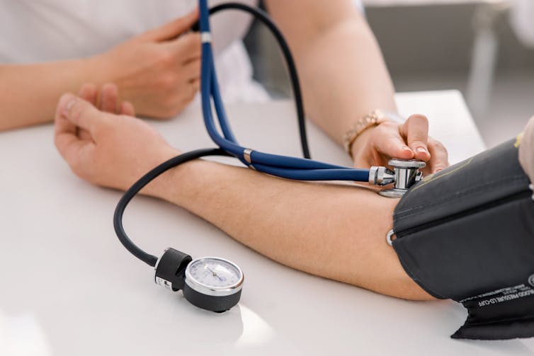 Woman gets her blood pressure check.