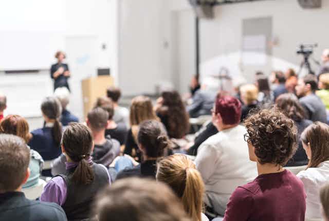 Mixed group of students listening to a lecture