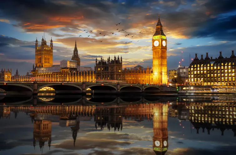 An evening view of UK parliament buildings.