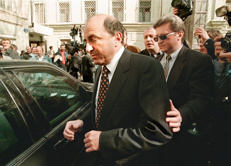 Oligarch Boris Berezovsky about to get into a limousine.