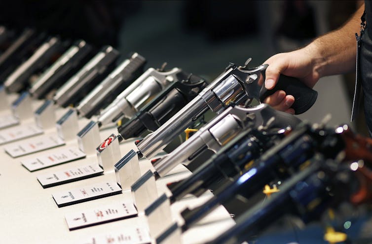 Smith & Wesson handguns on display at the Shooting, Hunting and Outdoor Trade Show in Las Vegas, Jan. 19, 2016. AP Photo/John Locher