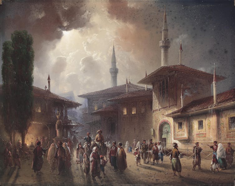 A painting of a palace with minarets going high up into the clouds in the sky and people outside it, some of horseback.
