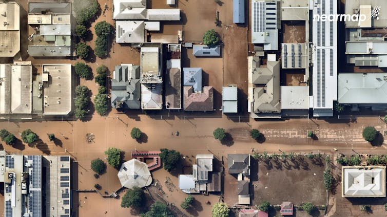 aerial view of flooded streets and roofs