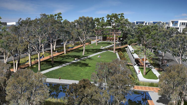 aerial view of park with apartments in background