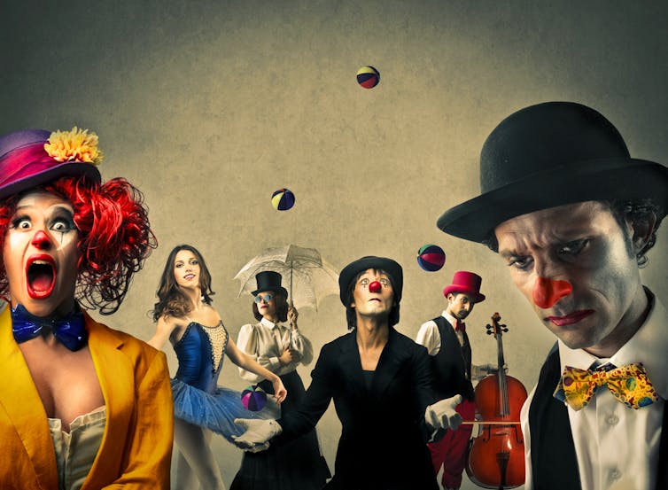 Circus performers, including clown, juggler