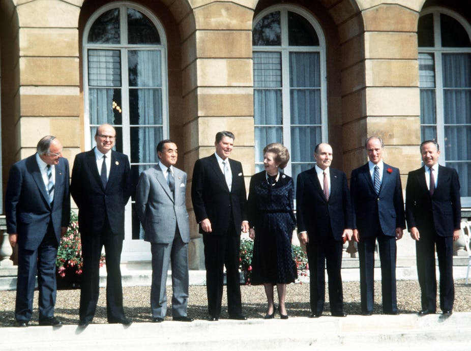 Western leaders standing in line for economic summit in London in mid-1980s.