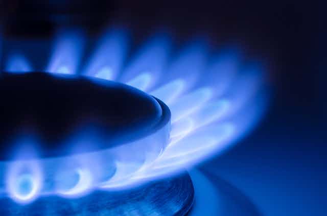 A gas hob with a blue flame.