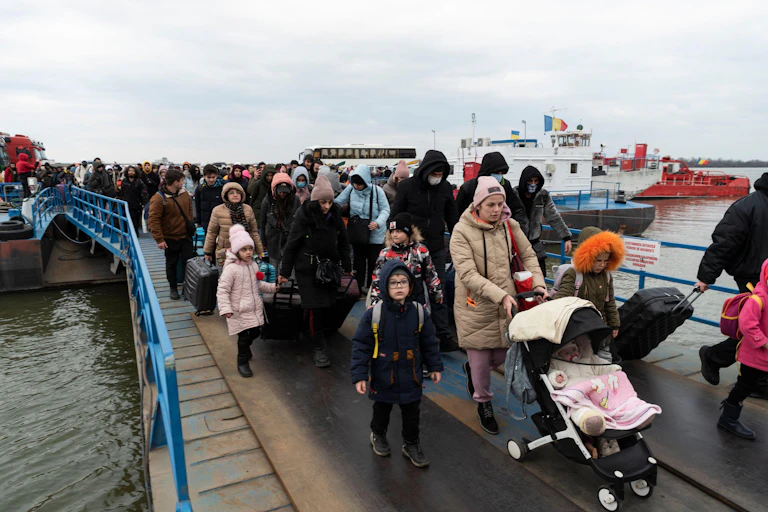 Ukrainian refugees arrive at the border crossing station of Isaccea, Romania