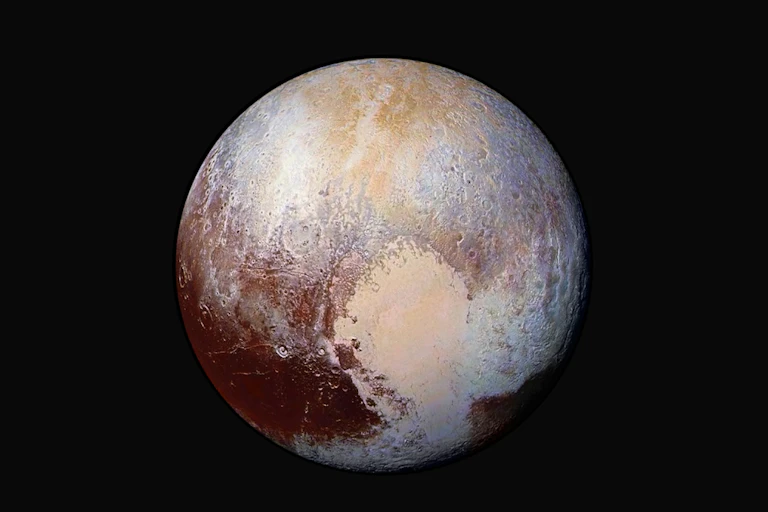 An images of the dwarf planet Pluto, showing colors of maroon, beige and white.
