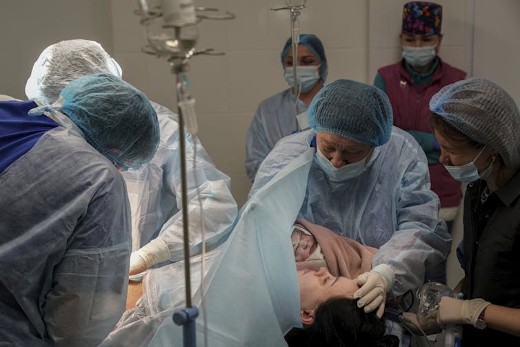 Surgeons performing Caesarean