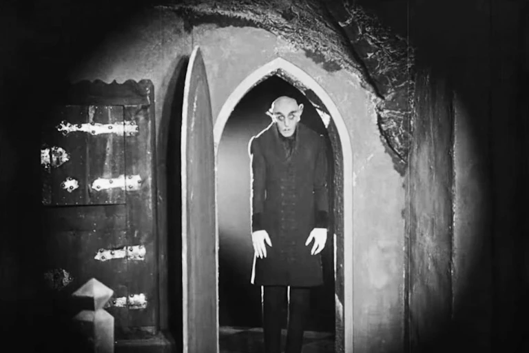 Vampire in doorway.