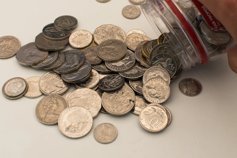 Money jar being tipped out