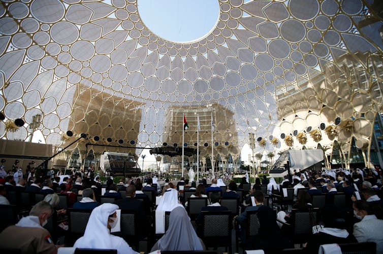 Delegates gathering to hear a speech at the Dubai Expo 2020.