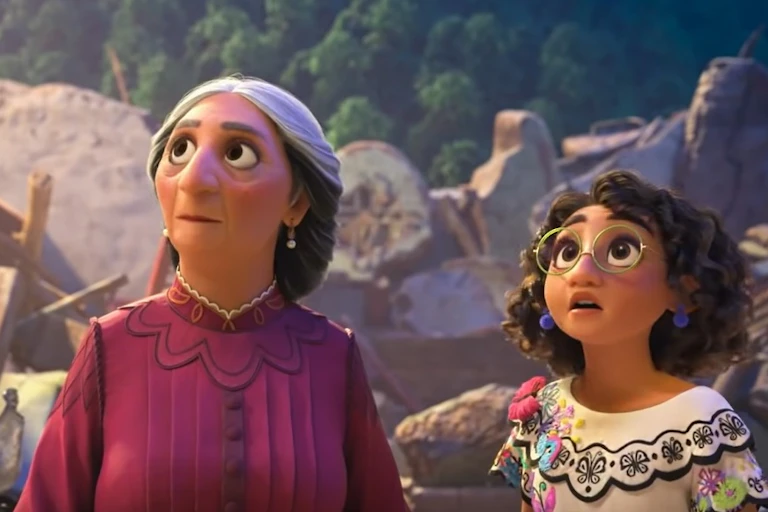 A grandma and young girl seen looking up.