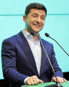 A man standing behind a podium