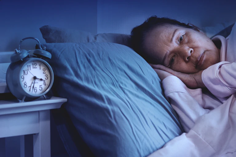 Woman awake in the middle of the night.