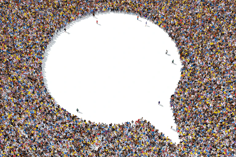 A thought bubble made of the movement of people is seen in aerial view.