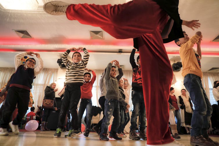 children mimic a ballet dancer