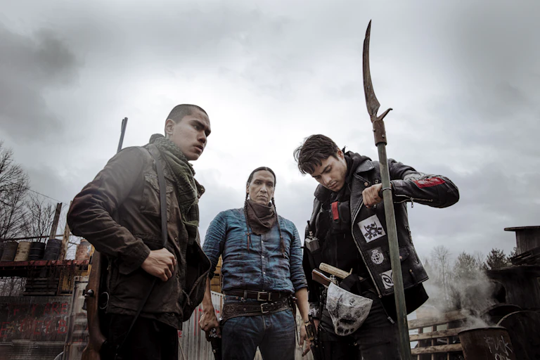 three armed men stand together