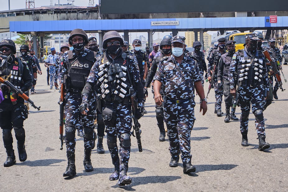 Policemen in riot gear and AK-47s during a demonstration against the re-opening of the Lekki toll plaza in Lagos.