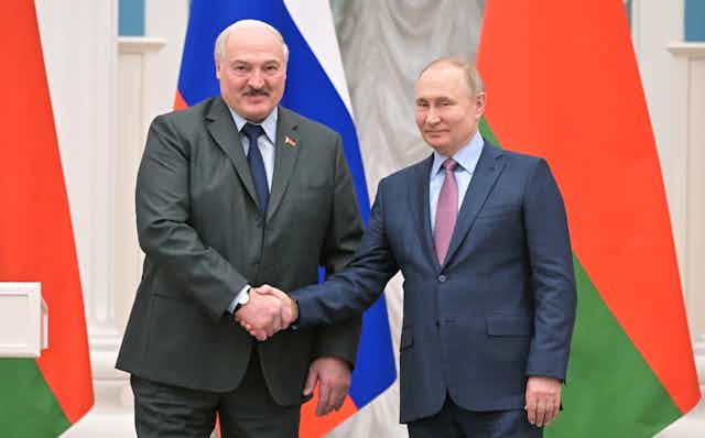 Belarus president, Alexandr Lukashenko, shakes hands with Russian president, Vladimir Putin