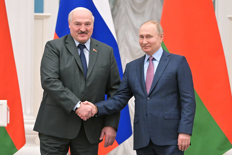 Belarus president, Alexandr Lukashenko, shakes hands with Russian president, Vladimir Putin
