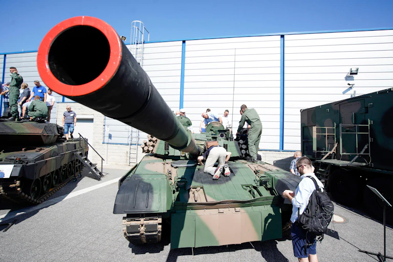 A tank being examined at a Polish arms fair