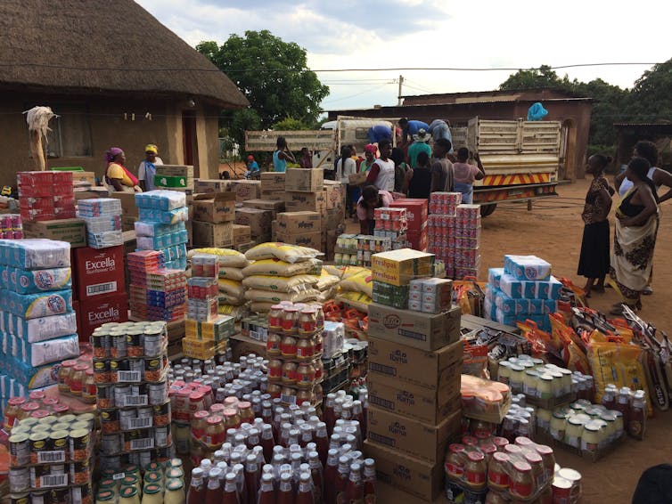 Boxes are piled high as a truck delivers bulk grocery purchases.