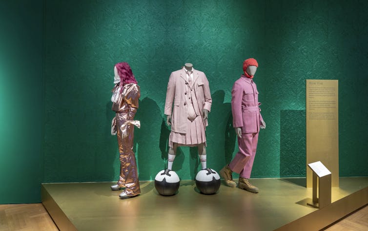 A set of three mannequins at the V&A's new show about men's fashion.