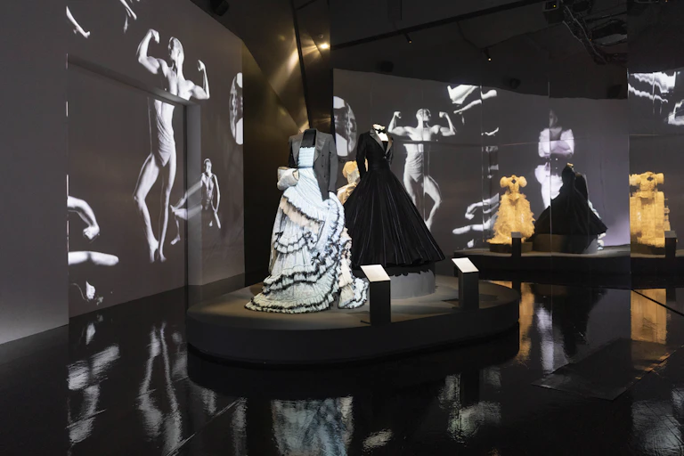A set up of dresses worn by men at the Fashioning MAsculinities exhibition at the V&A.