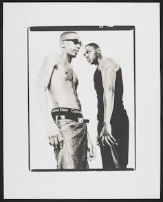 Two young black men in a black and white fashion photograph.