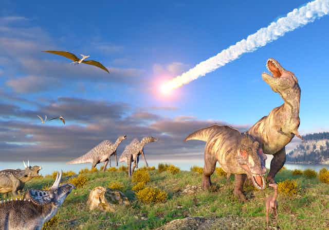 Dinosaurs look up and roar as a white light streaks across the sky
