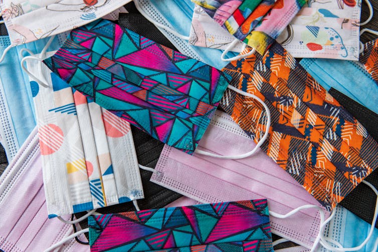 Colourful surgical masks in a pile
