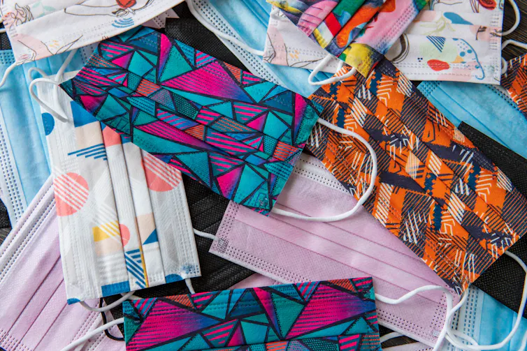 Colourful surgical masks in a pile