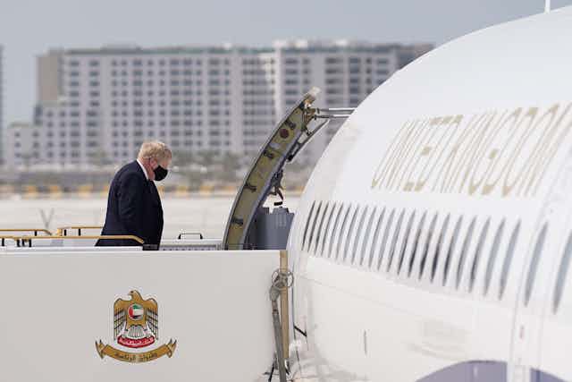 Boris Johnson walking towards a plane entrance on way to Saudi Arabia.