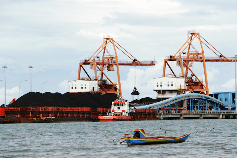 Coal to fuel a power plant in Jeneponto, South Sulawesi, is being unloaded.