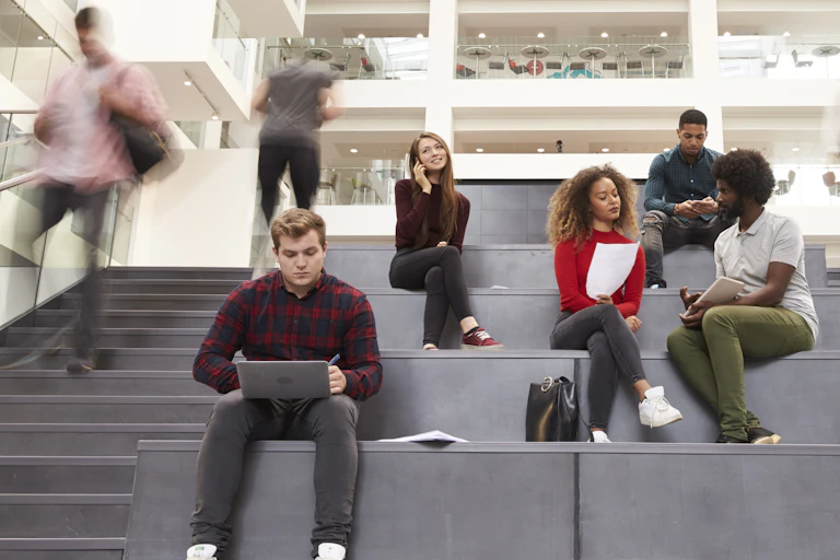 Students rushing up steps.