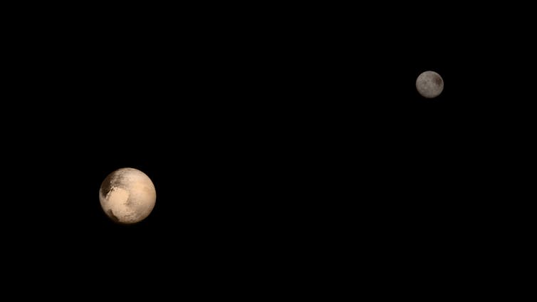 A photograph of Pluto and one of its five moons, Charon.