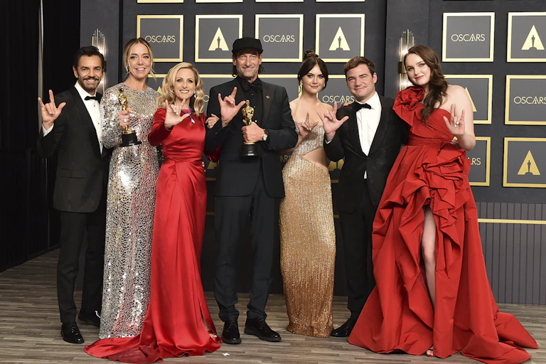 The cast of CODA saying 'Love' in ASL