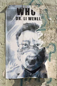 torn poster on wall