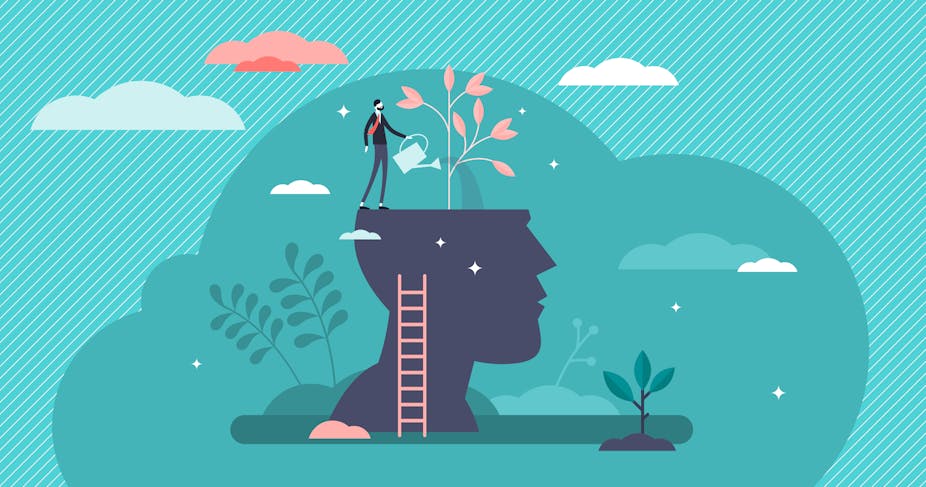 A visual representation of caring for mental health, with an animated man standing atop a silhouette of a head, pouring water from a watering can into his head, where a tree grows out of it.