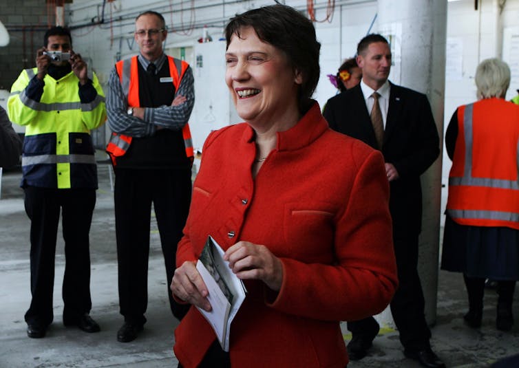 Helen Clark in red jacket