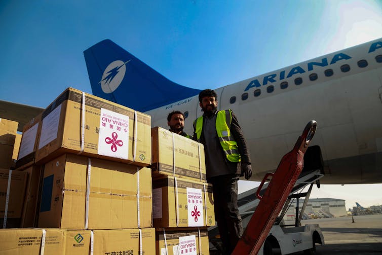 COVID vaccines donated to Afghanistan by China being unloaded from a plane