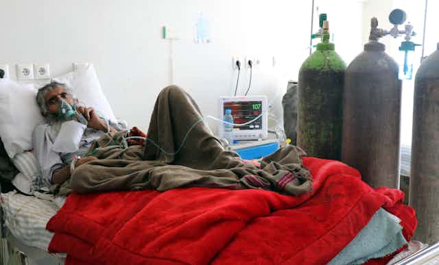 A COVID patient being given oxygen in a hospital in Kandahar, Afghanistan