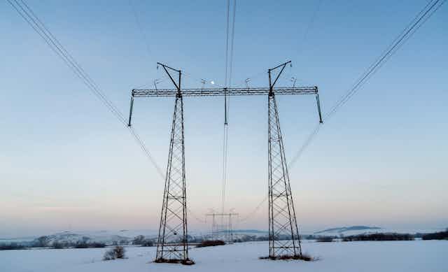Power lines above snowy field