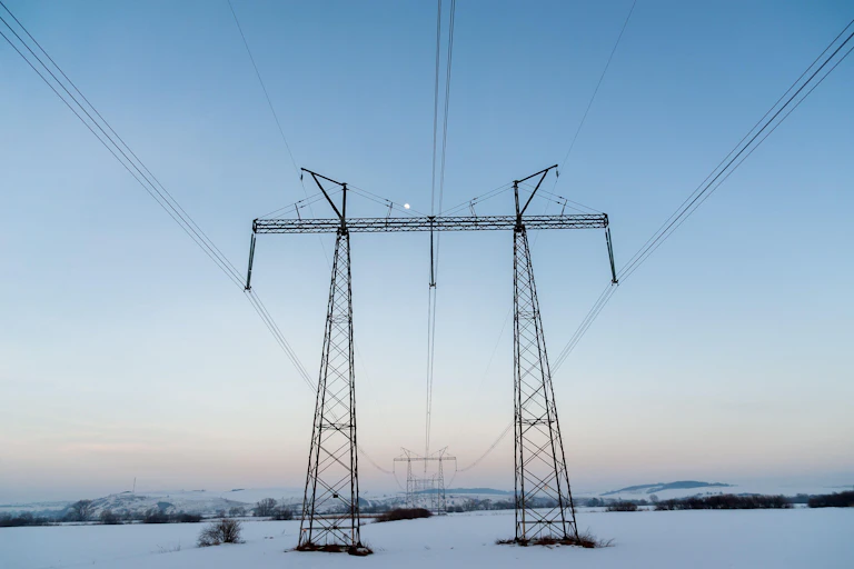 Power lines above snowy field