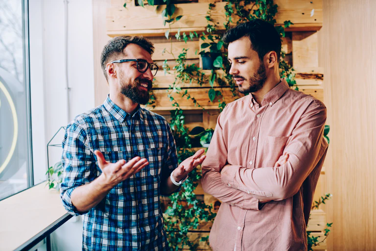 Two young men talking.